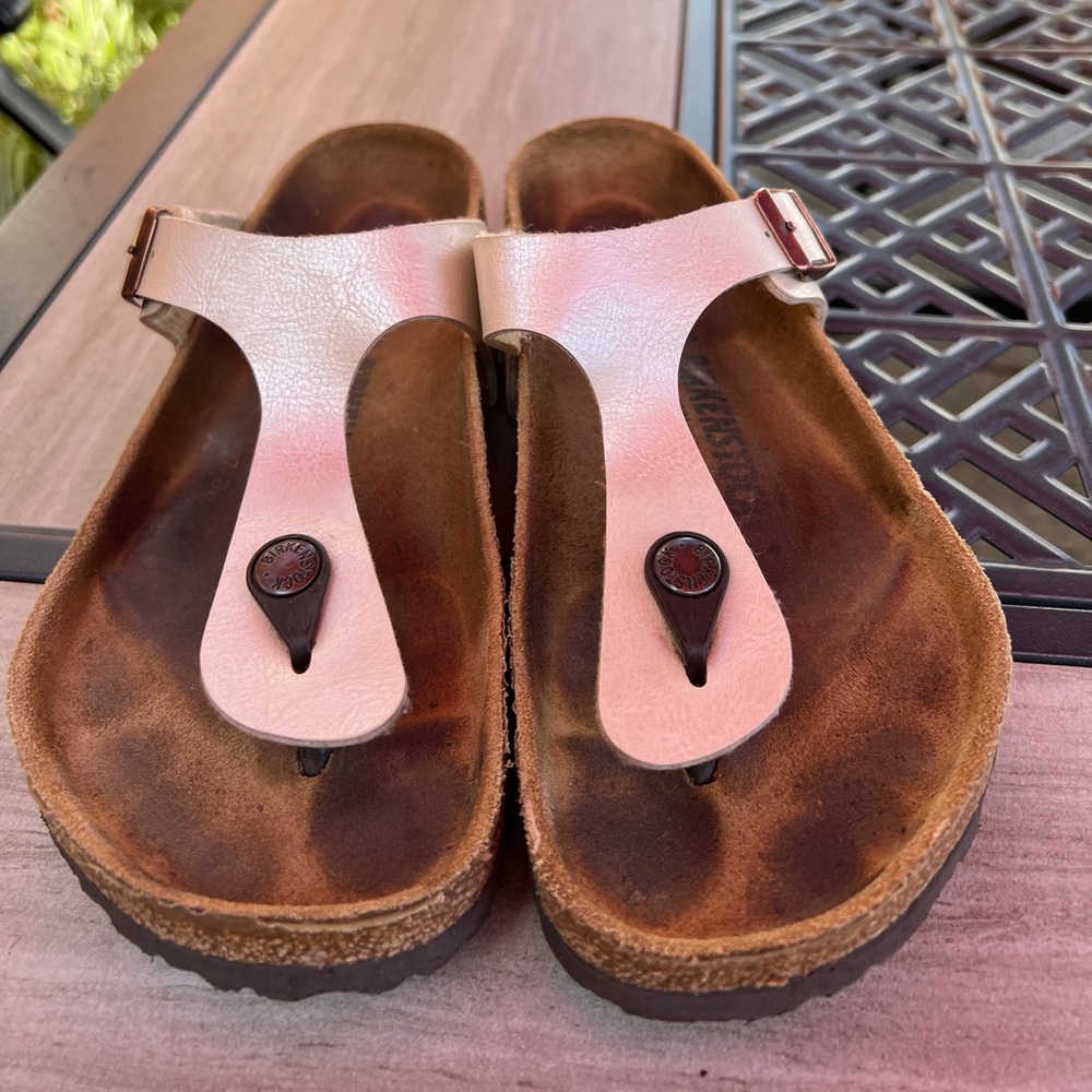 Pearl/white Birkenstocks in size 8.
